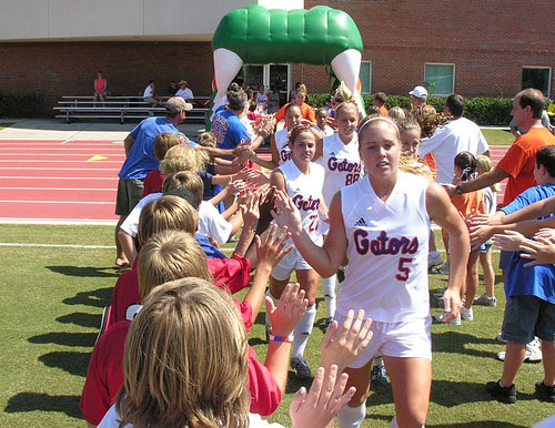  Florida Gators fans greet soccer players as they run through Gator Tunnel before game 
