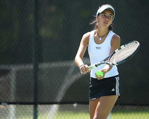 Lady Bulldog prepares for tennis serve