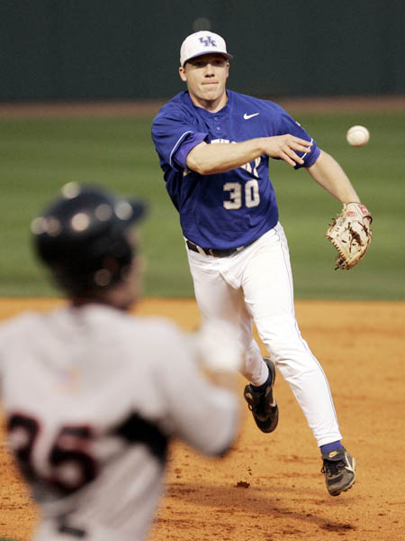  UK's second baseman turns the double play 