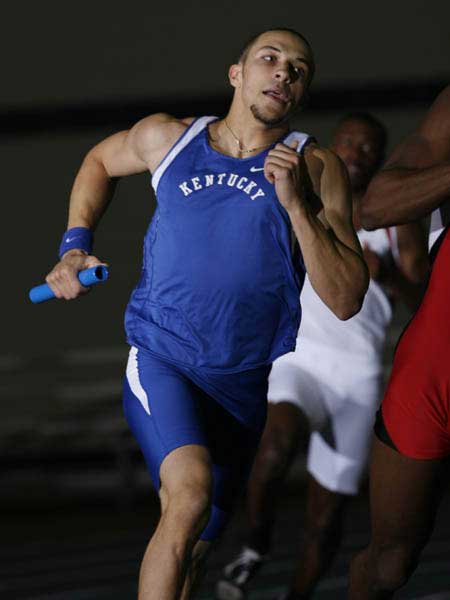 Kentucky relay race runner with baton