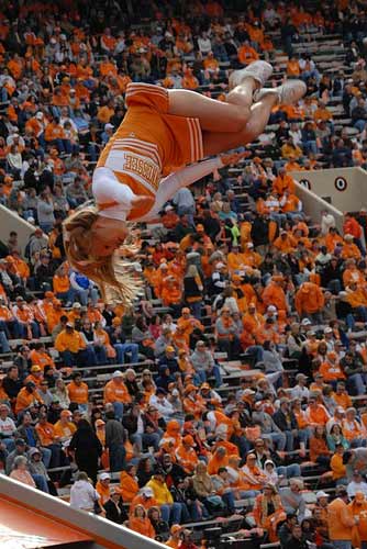 Tennessee cheerleader in the air.