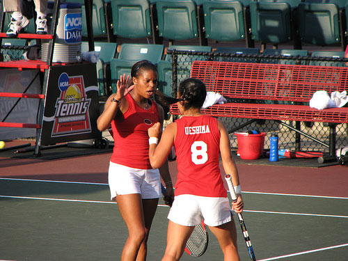  Lady Bulldogs doubles partners celebrate point 