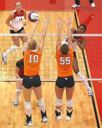 UT volleyball players go for the block against Georgia