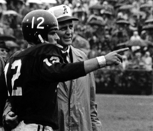 Pat Trammel talking to Bear Bryant on the sidelines in during the great 1961