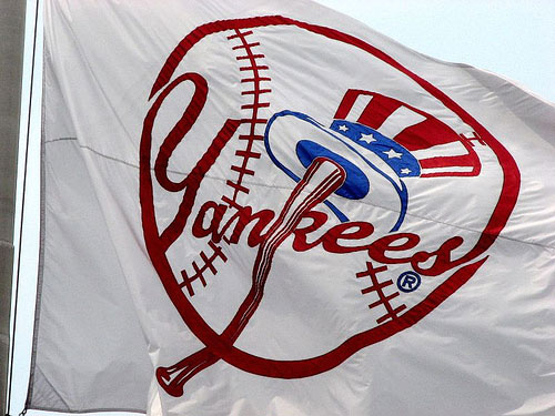Huge NY Yankees flag blows in wind.